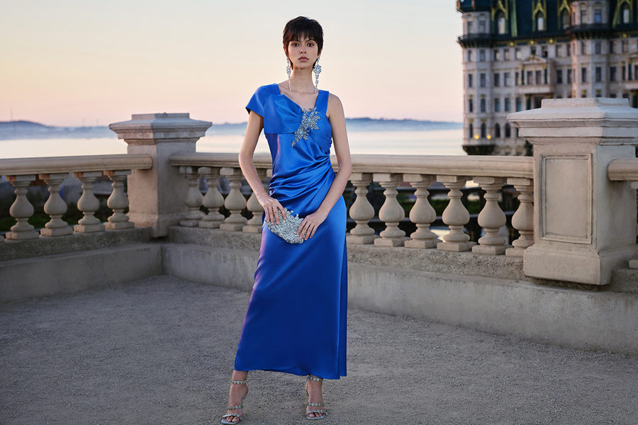 Woman in blue satin formal gown