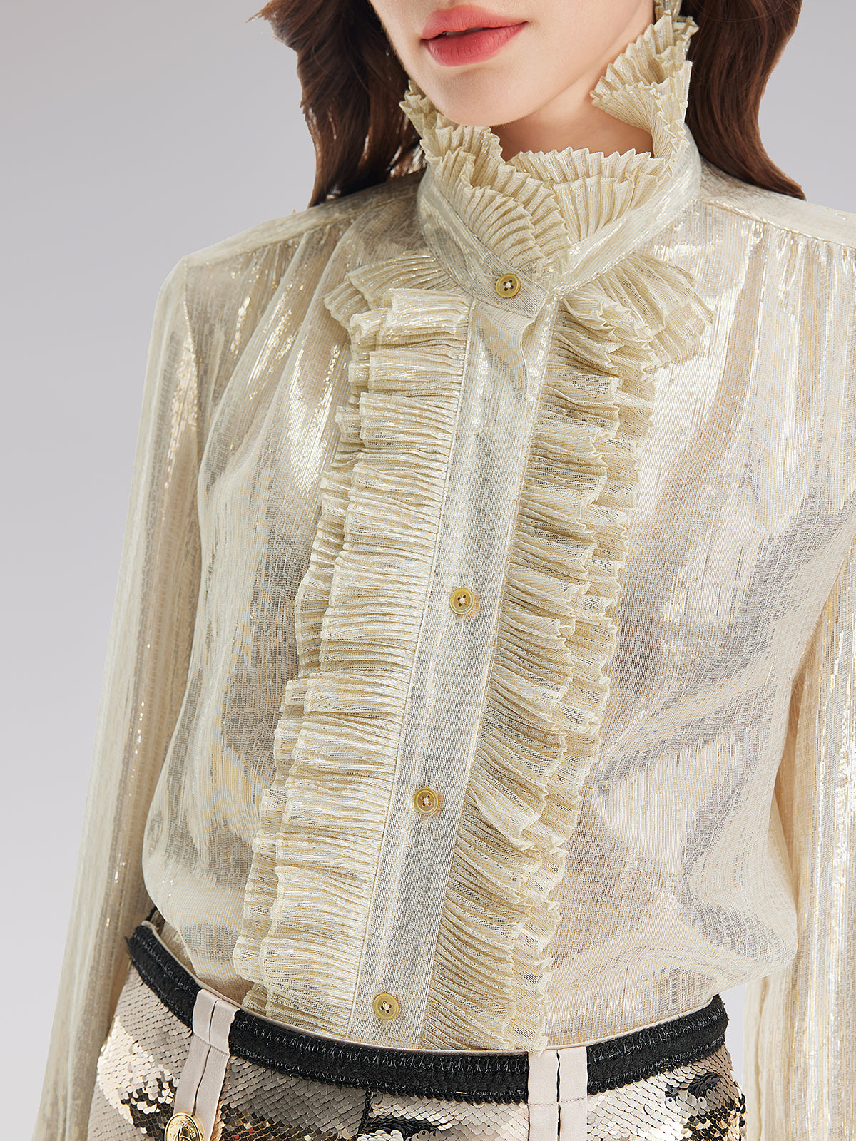 Elegant ivory sheer blouse with layered ruffle details and sparkling sequin skirt outfit