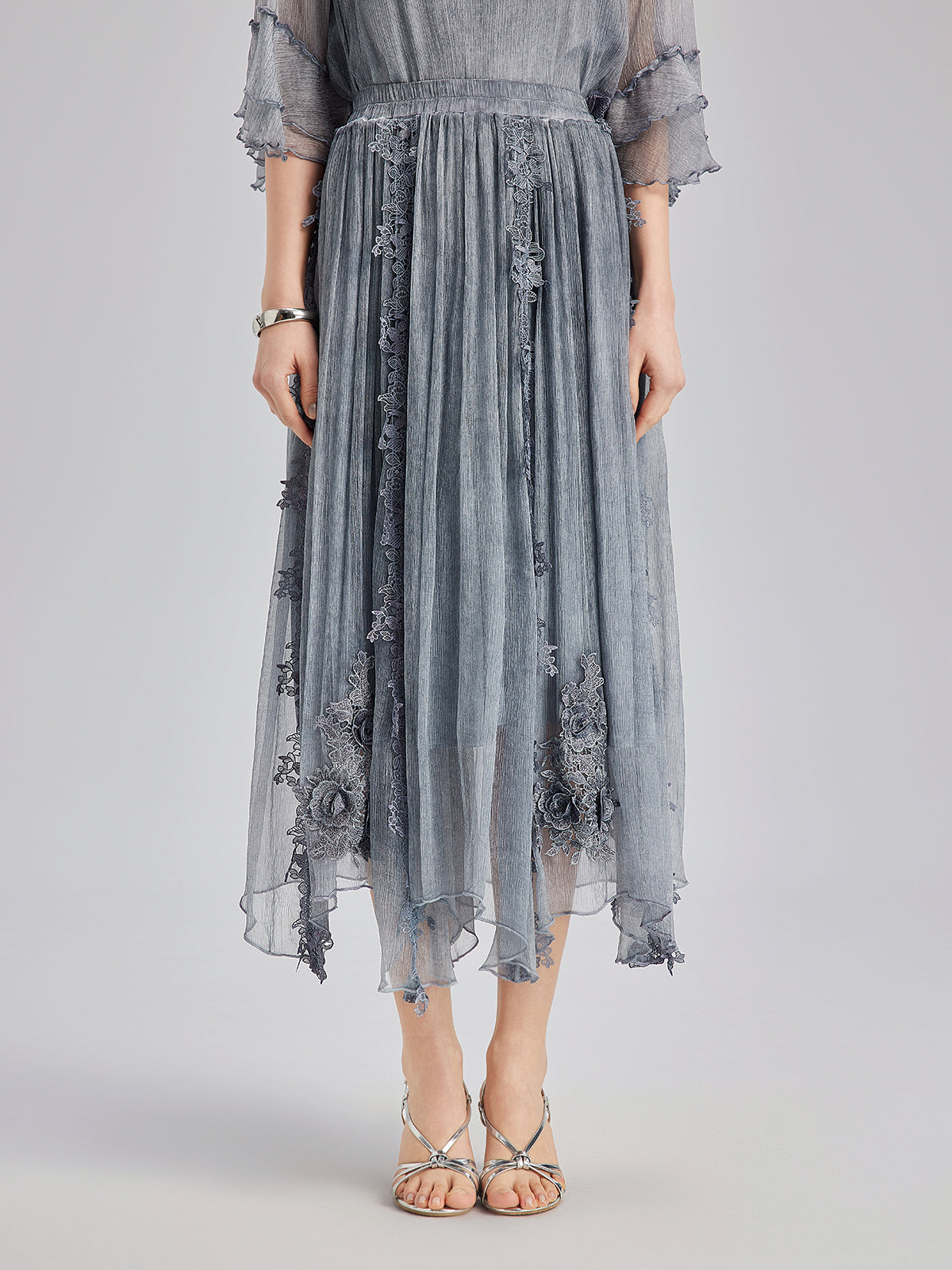 Contemporary garment with structured silhouette and smooth finish