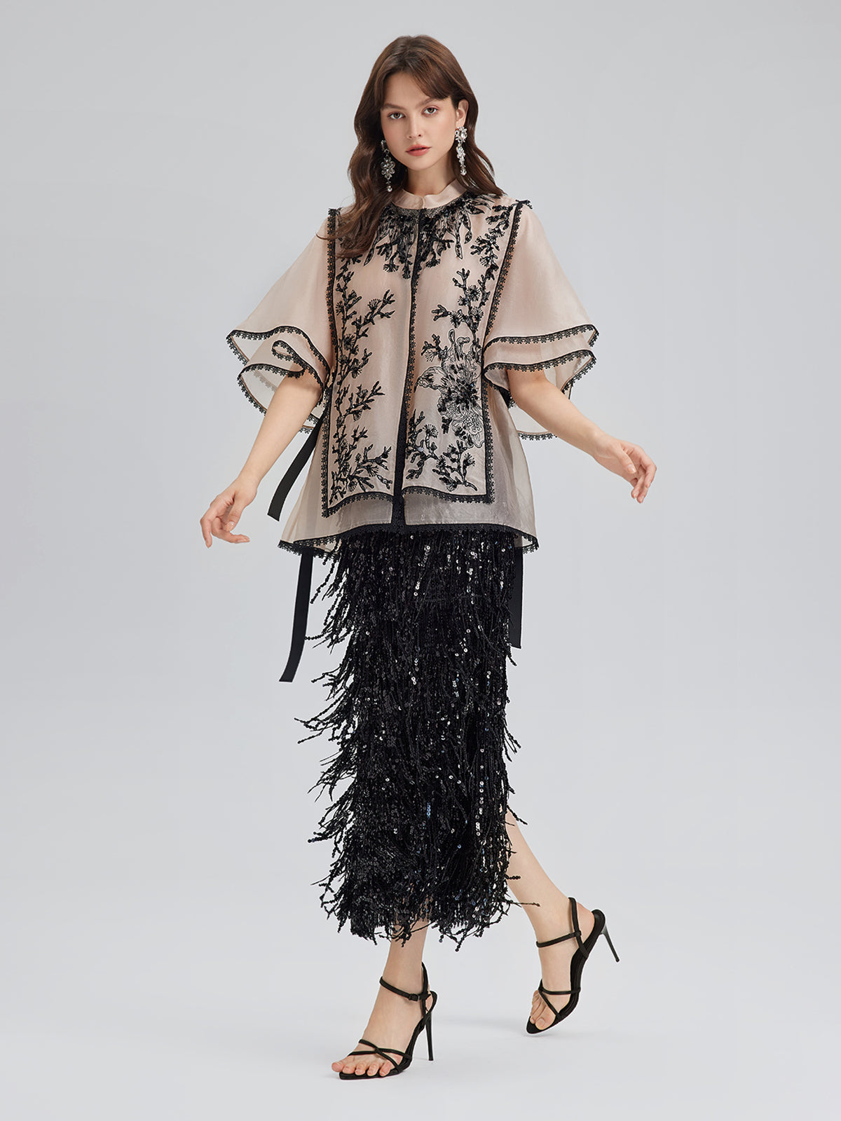 Modern apparel item with structured silhouette and smooth finish