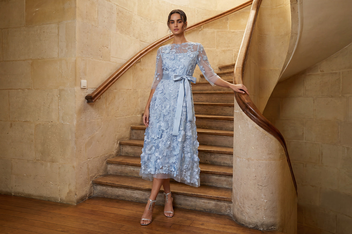 Blue floral lace formal dress on staircase