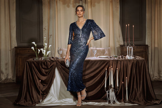 Woman wearing a fitted navy sequin V-neck formal gown at an elegant candlelit dinner