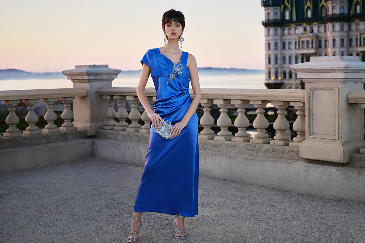 Woman in blue satin formal gown