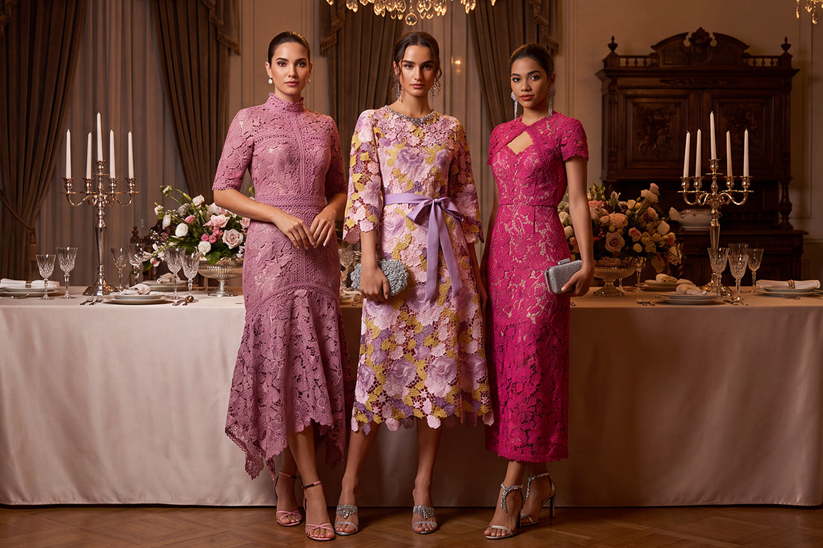 Models in pink lace embellished midi dresses