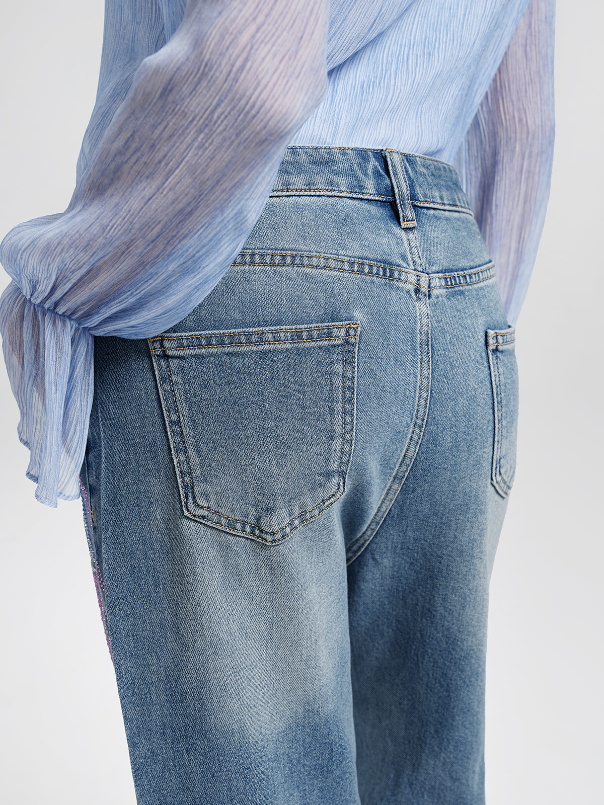 Rhinestone-Embellished Feather Denim Jeans