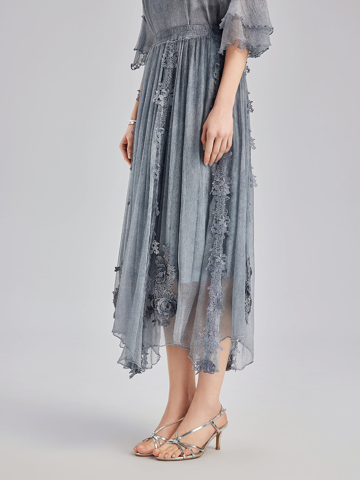 Modern garment with structured silhouette and refined texture