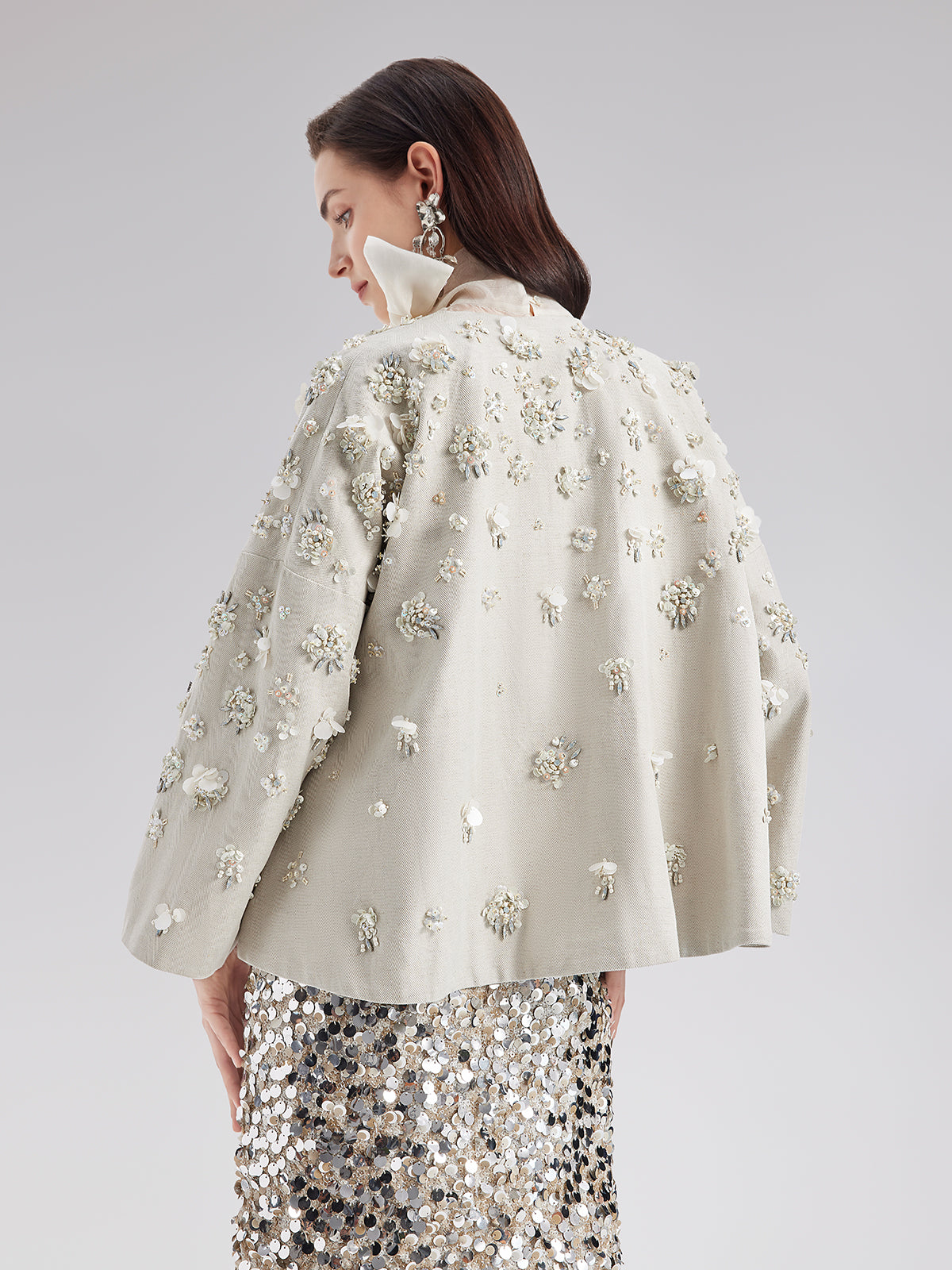 Contemporary garment with smooth texture and refined silhouette