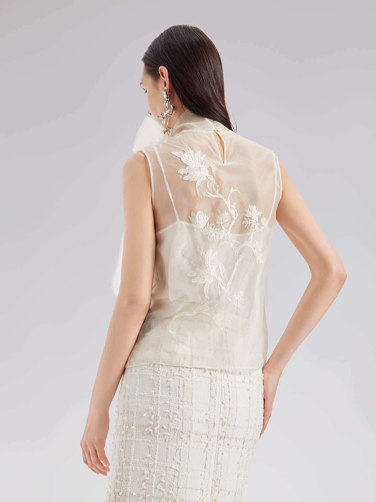 Modern apparel item with structured silhouette and refined finish